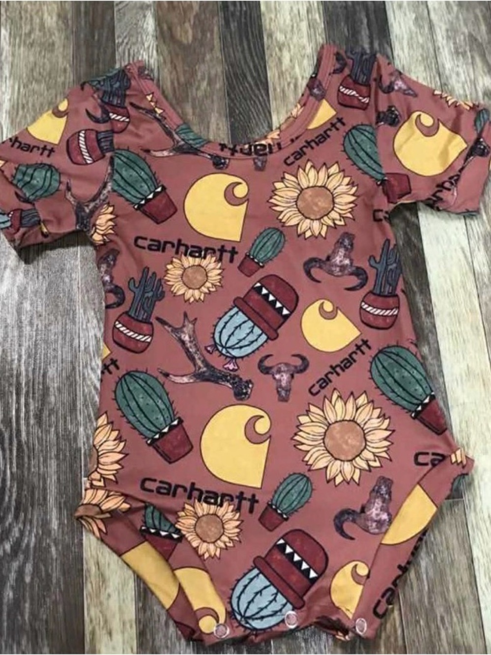 Rust Baby Bodysuit with Yellow Logo & Green Cacti Print